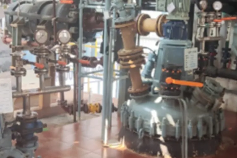 Glass-lined reactor with process piping, valves and gauges at the manufacturing plant